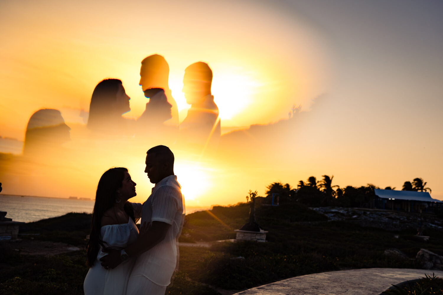 Honeymoon photography in Isla Mujeres – couple walking along the beach at sunset.